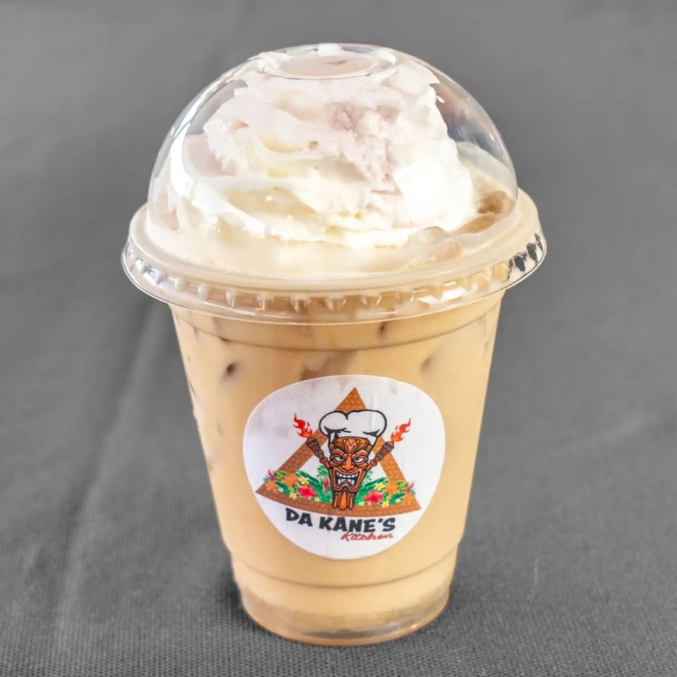 Iced coffee with whipped cream in a clear plastic cup with Da Kane's Kitchen logo.