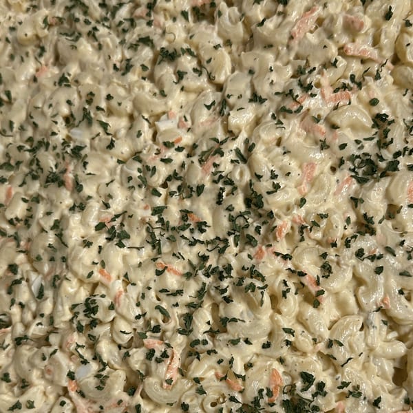 Creamy macaroni salad with chopped carrots and parsley, a classic American side dish from Da Kane's Kitchen.